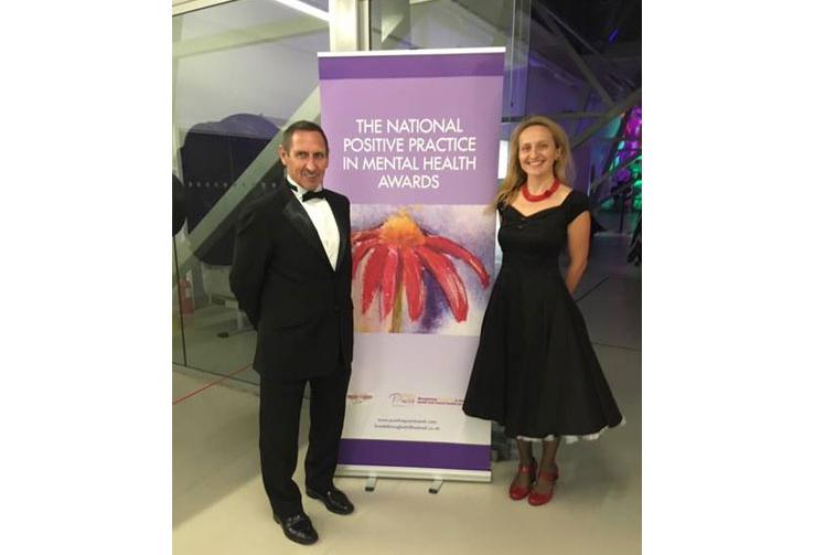 two people in front of the national positive practice mental health awards