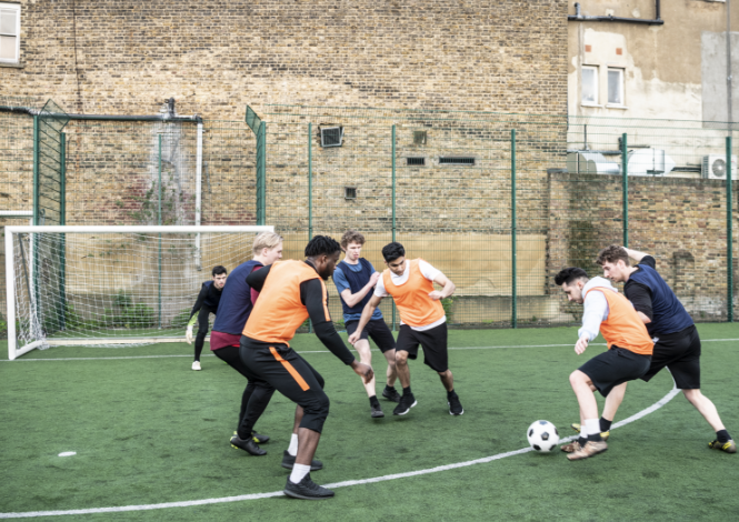 group of men playing football